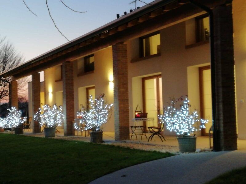 The porch lit up at sunset, seen from the entrance